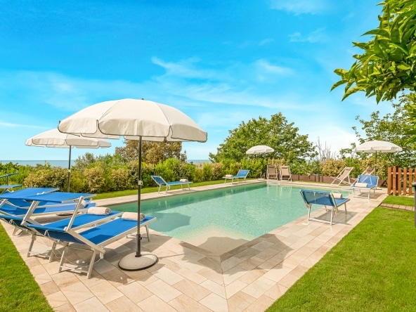 anoramic swimming pool with sea and countryside views